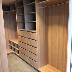 Walk-In-Wardrobe-Polytec-Natural-Oak-Colour-Board-Shelving-Banks-of-Drawers-Chrome-Hanging-Rods