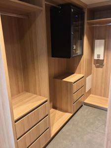 Walk-In-Wardrobe-Polytec-Natural-Oak-Colour-Board-Shelving-Banks-of-Drawers-Chrome-Hanging-Rods2
