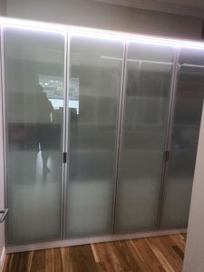 Polytec-Frosted-Glass-Doors-in-Front-of-Chrome-Hanging-Rods