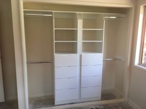 WhiteBoardBuilt-InShelvingwithBanksofDrawersandHangingRods-DarranHeppleston